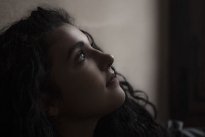 Close-up of teenage girl looking away