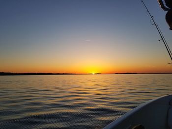 Scenic view of sea against clear sky during sunset