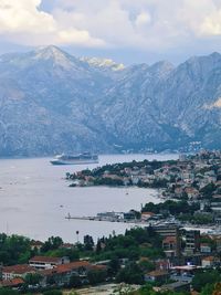 Scenic view of sea and mountains against sky