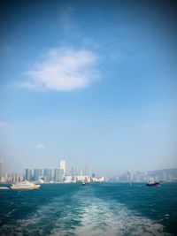 Scenic view of sea and buildings against sky