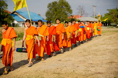 Group of people walking on road