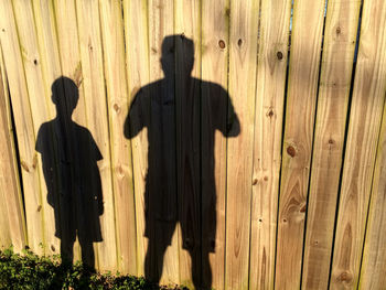 Shadow of people on wooden floor