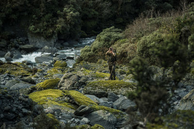 Man looking through binoculars