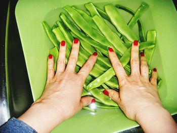 Close-up of cropped hand holding apple