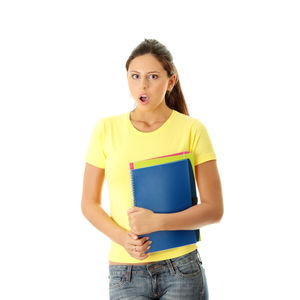 Portrait of woman standing against white background