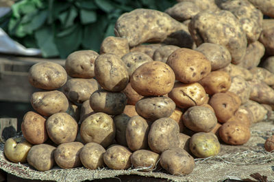 Piles of potatoes on the floor of the nkol eton market in cameroon