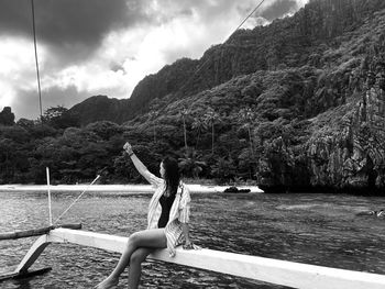 Woman sitting over water 