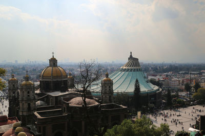 Buildings in city against sky