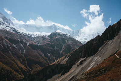 Scenic view of snowcapped mountains against sky