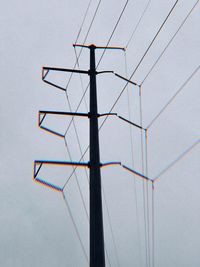 Low angle view of metallic structure against sky