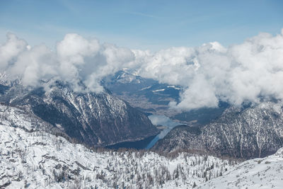 Panoramic view of mountains against sky during winter