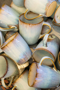 Handmade ceramic mugs stacks background