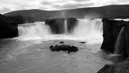 Scenic view of waterfall, godafoss.