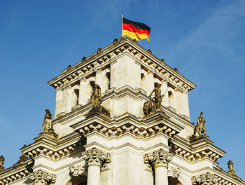 Low angle view of traditional building against blue sky