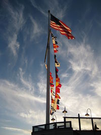 Low angle view of flag against sky