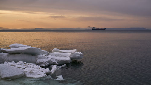 Scenic view of sea against sky during sunset