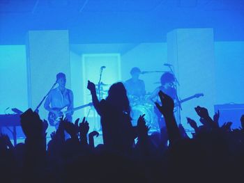 Silhouette of people in nightclub