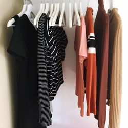 Panoramic view of clothes hanging in rack