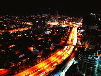 High angle view of light trails in city at night