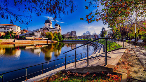 Stairs next to lake with cathedral in background