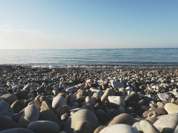 Rocks on beach against sky