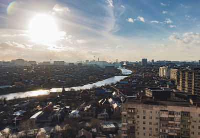 High angle view of city buildings against sky