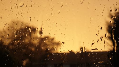 Full frame shot of wet glass window during rainy season