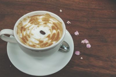 High angle view of coffee cup on table