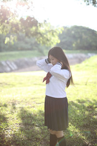 Woman standing on field