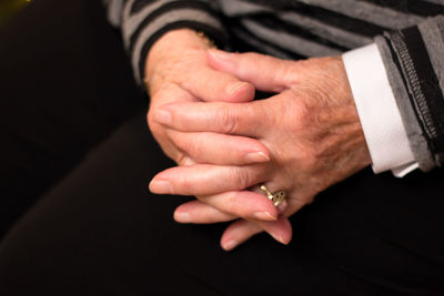 Close-up of couple holding hands