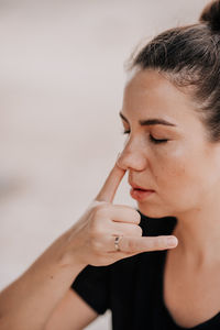 Close-up of young woman looking away