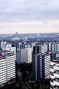 High angle view of buildings in city against sky