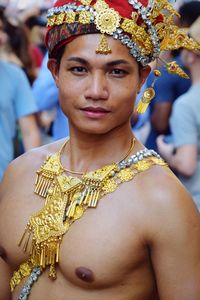 Close-up portrait of shirtless young woman