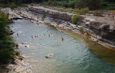 High angle view of people swimming in river