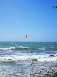 Scenic view of sea against clear blue sky