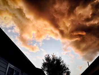 High section of building against cloudy sky