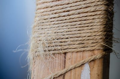 Close-up of rope tied on wooden post