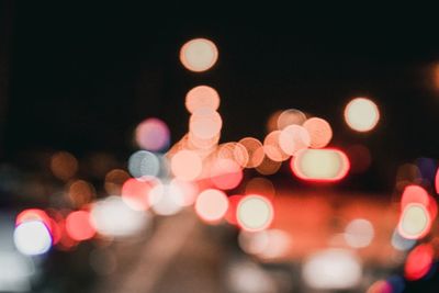 Defocused image of illuminated lights at night