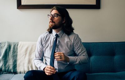 Portrait of young man on sofa