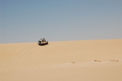 Scenic view of desert against clear sky