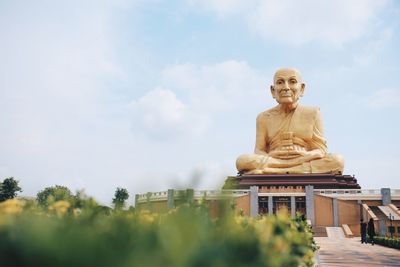 Low angle view of statue against sky