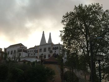 Built structure against cloudy sky