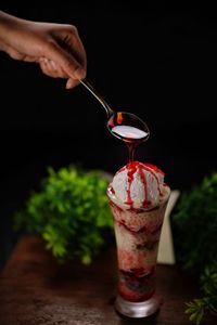 Close-up of hand holding drink