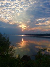 Scenic view of lake against sky during sunset