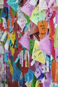 Full frame shot of adhesive notes on bulletin board during kala ghoda festival