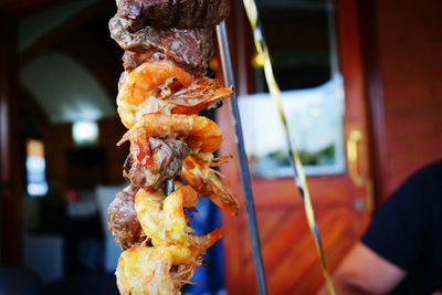 Close up of shrimp and steak on skewer