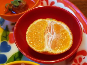 Close-up of orange juice in glass on table