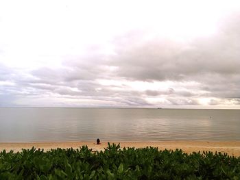 Scenic view of sea against cloudy sky
