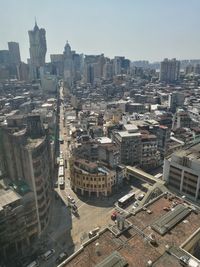 High angle view of buildings in city against clear sky