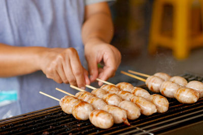 Midsection of man preparing food